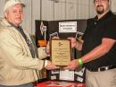 Alex Shovkoplyas, VE3NEA (left), receives his RAC Radio Amateur of the Year plaque from RAC Ontario South Director Phil Mcbride, VA3QR. [Mike Goldstein, VE3GFN, photo] 